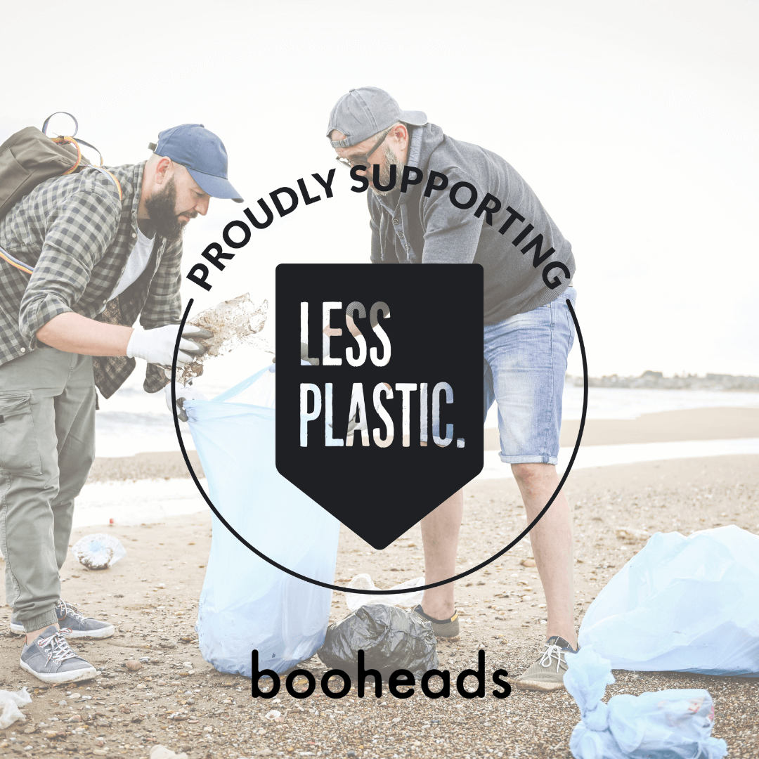 Two people participating in a beach cleanup with 'Proudly Supporting Less Plastic' text and 'booheads' branding.