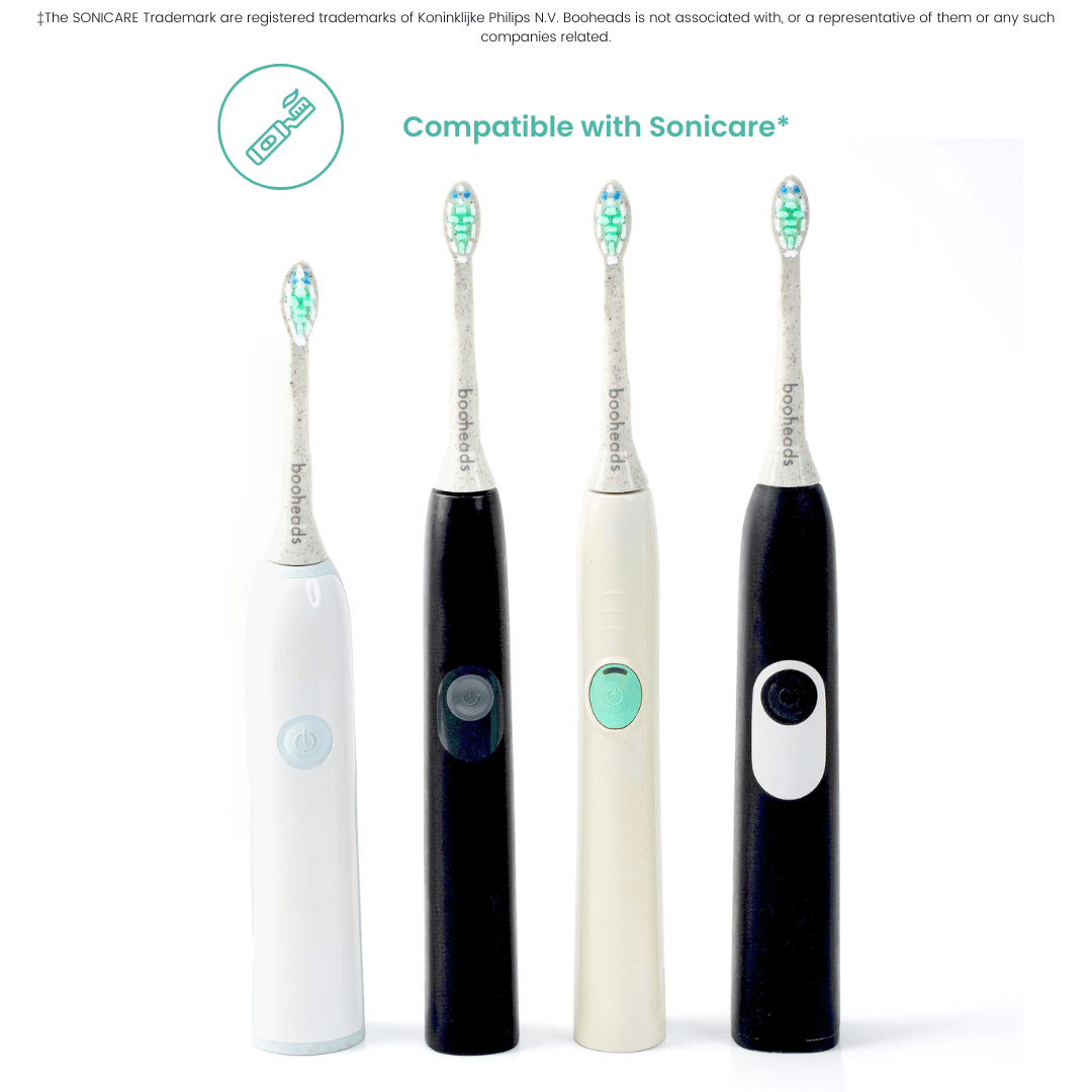 Two black and two white electric toothbrushes on a white background with Sonicare branding.