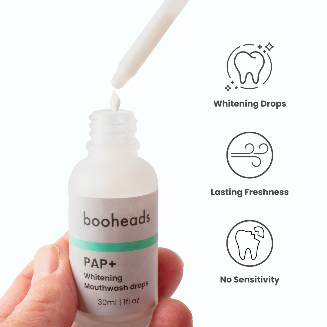 booheads PAP+ Whitening Mouthwash Drops bottle and dropper close-up with benefit icons