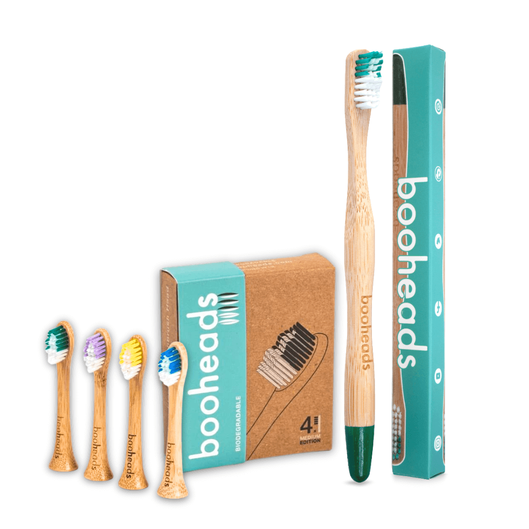 Bamboo toothbrushes with packaging labeled 'booheads' on a white background
