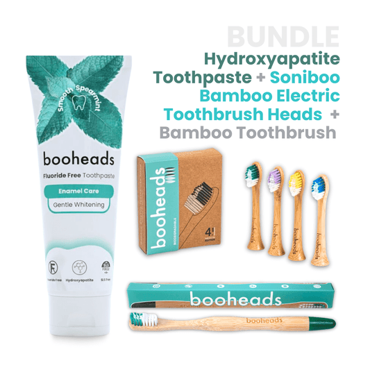 booheads toothpaste, bamboo electric toothbrush, and bamboo toothbrush heads on a white background