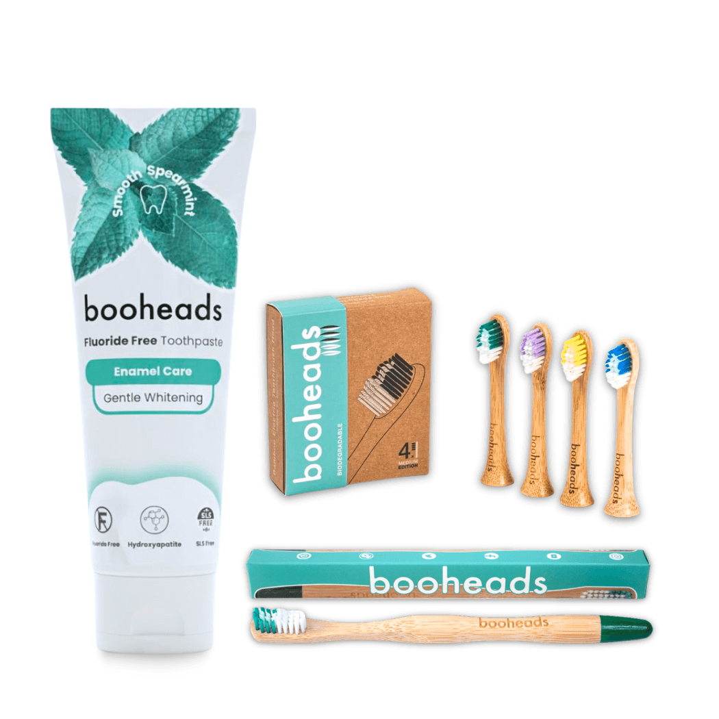 booheads toothpaste, toothbrushes, and packaging on a white background