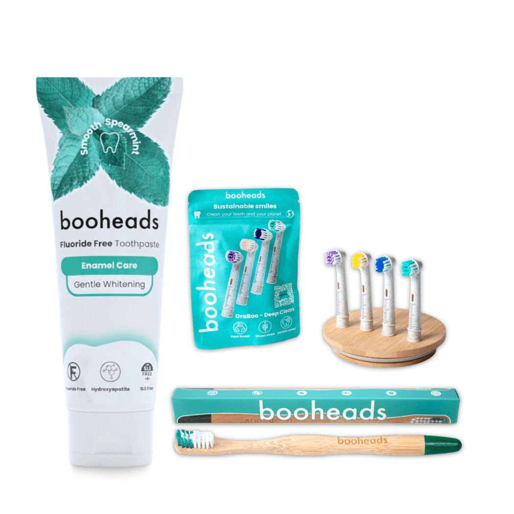 booheads dental care products including toothpaste, toothbrushes, and packaging on a white background