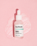 booheads PAP+ Whitening Mouthwash Drops 30ml glass dropper bottle on a pink background