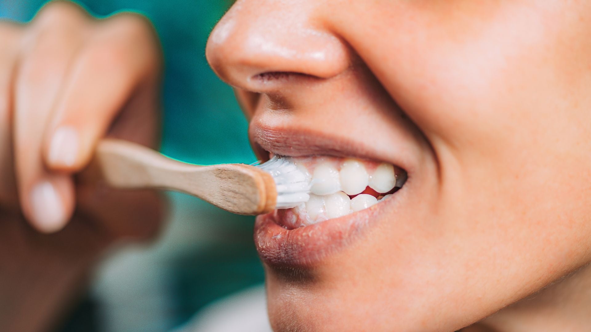 Brushing with a booheads bamboo manual toothbrush