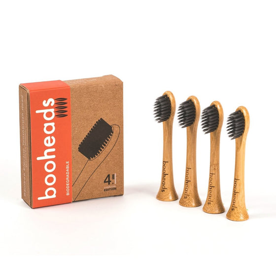 A pack of four charcoal bamboo electric toothbrush heads compatible with Sonicare, displayed alongside its packaging.